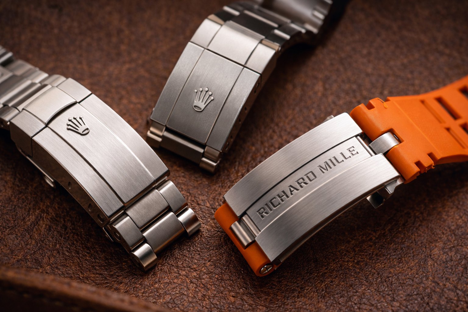 Replica watch clasp and bracelet material comparison across different watch styles