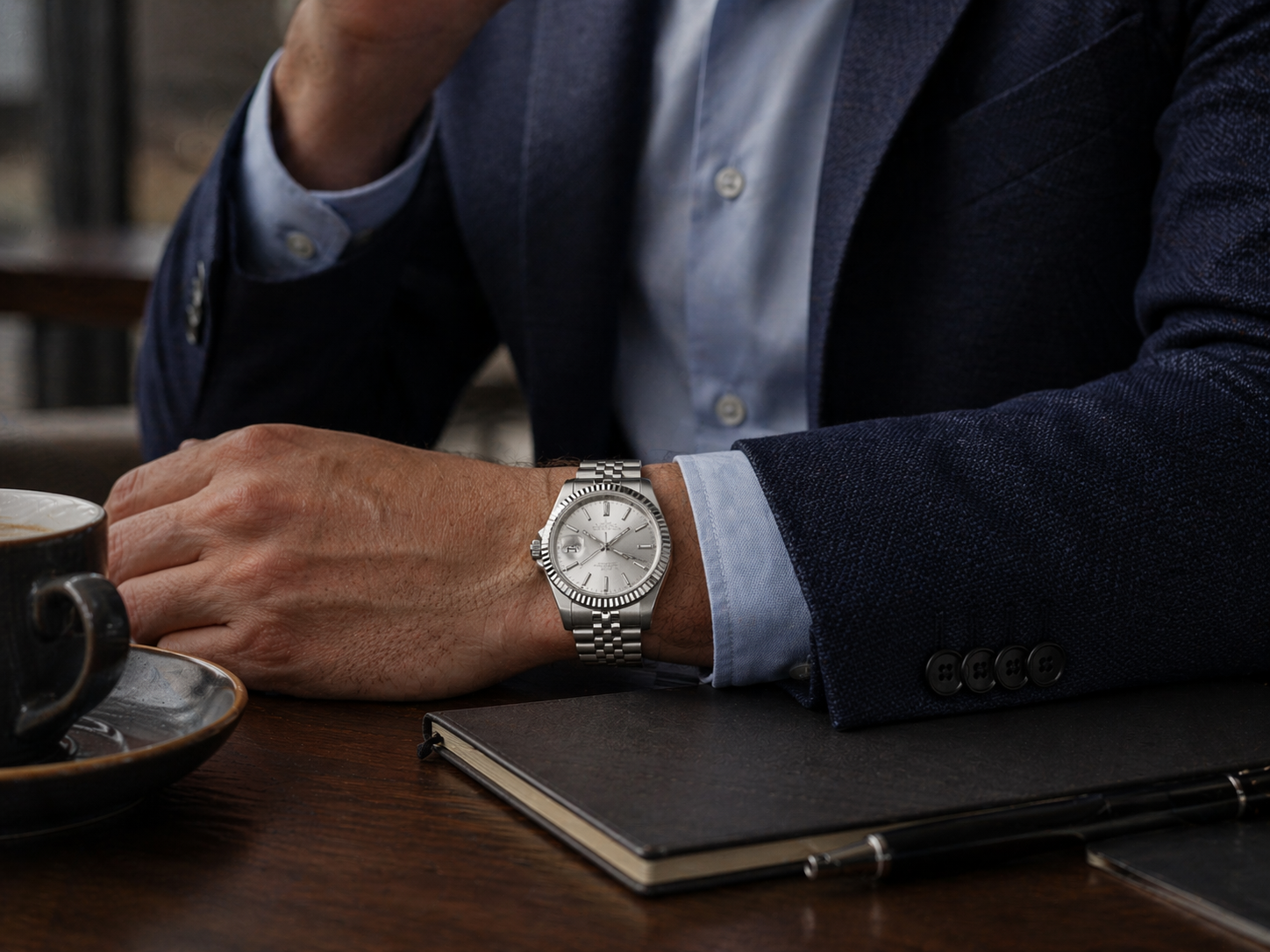 Rolex Datejust replica on wrist, showcasing a polished and professional design suitable for business meetings