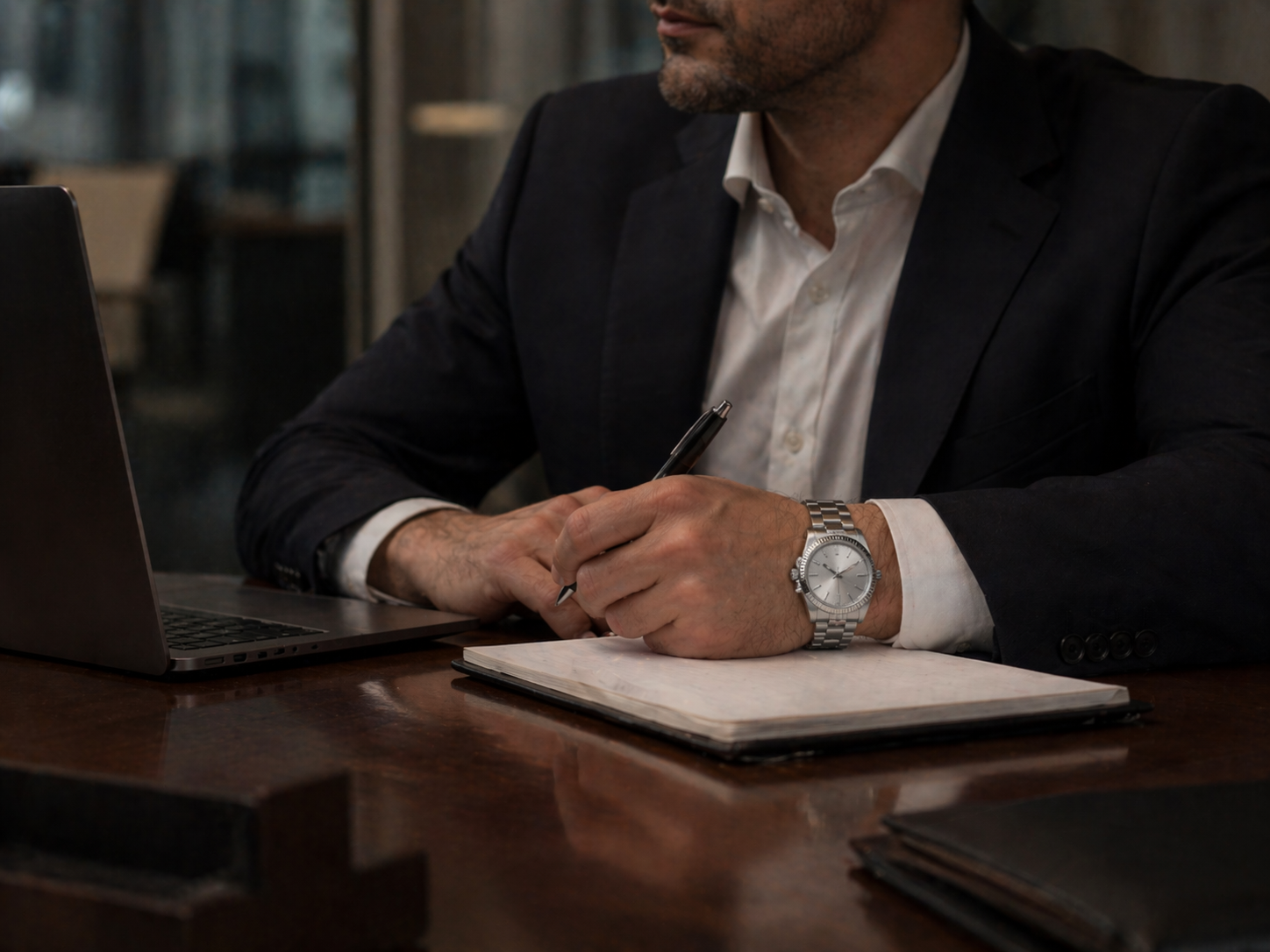 Luxury-style replica watch in a meeting room setting showing refined indoor wear and visual stability