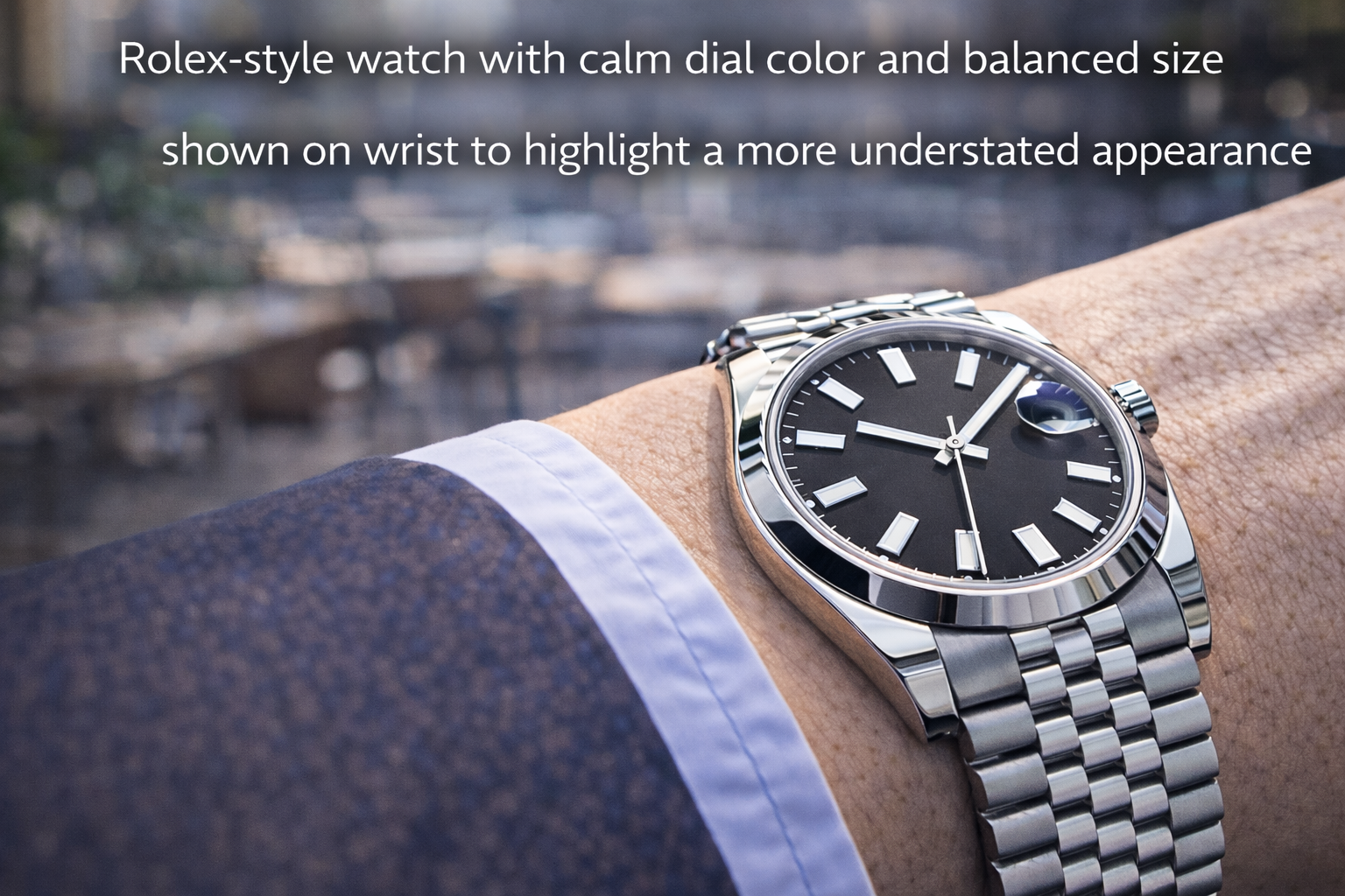 Rolex-style watch with calm dial color and balanced size shown on wrist to highlight a more understated appearance